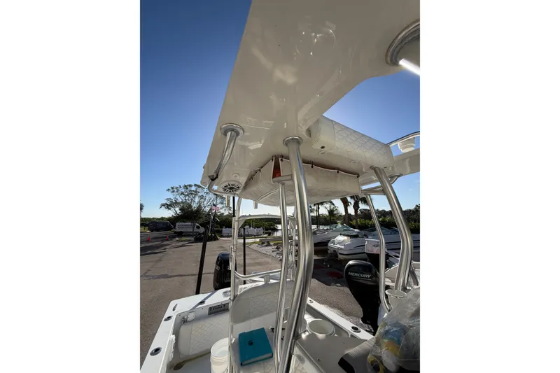 Slide: The Image of 2007 Andros 26 Tarpon boat with T-top and Mercury engine in sunny marina. - 9