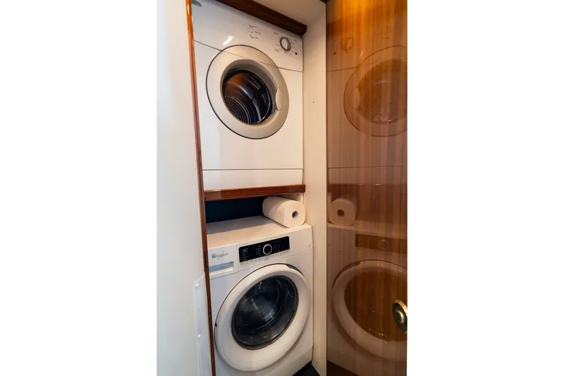 Slide: The Image of Stacked washer and dryer in 2005 Viking 45 Convertible yacht interior. - 33