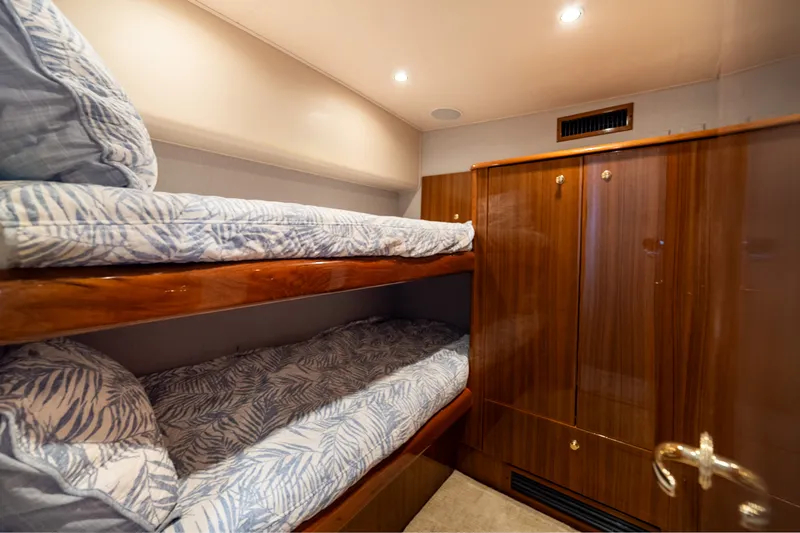 Slide: The Image of Bunk beds in 2005 Viking 45 Convertible yacht cabin with wooden cabinetry. - 29