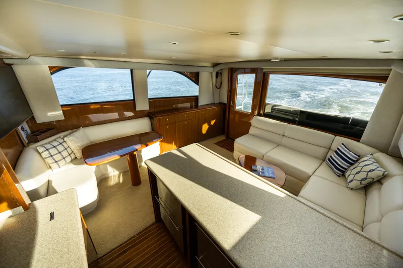 Slide: The Image of Luxurious interior of 2005 Viking 45 Convertible yacht with plush seating and ocean view. - 23