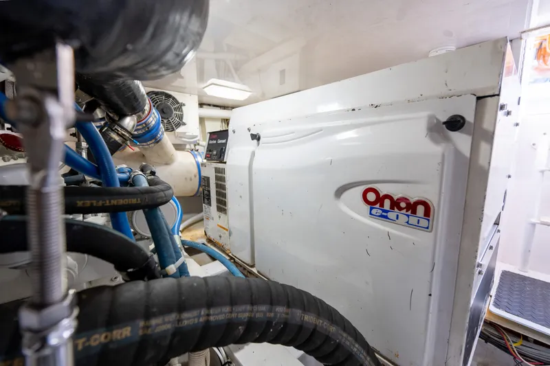 Slide: The Image of Engine room of 2005 Viking 45 Convertible with Onan generator and hoses. - 37