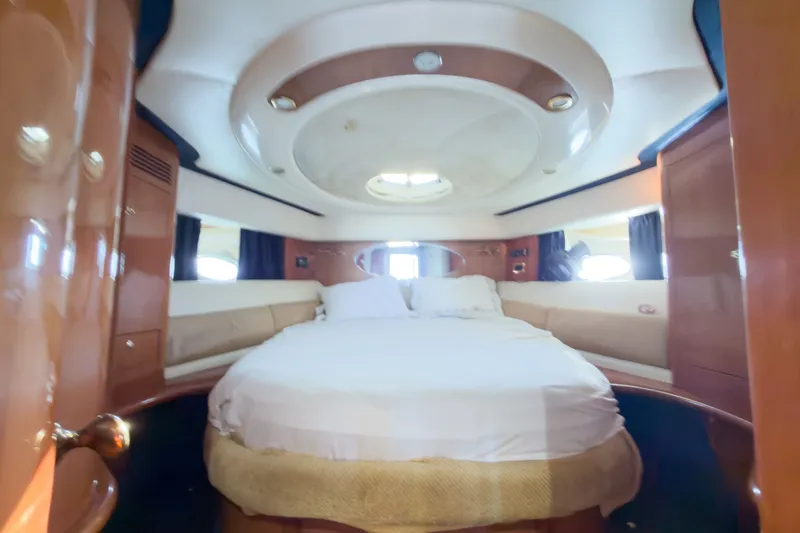 Slide: The Image of Luxurious cabin interior of 2002 Cranchi Atlantique 50 yacht with circular bed. - 14