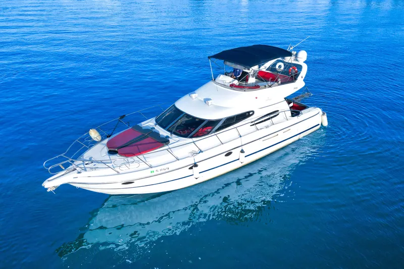 The Image of 2002 Cranchi Atlantique 50 yacht on calm blue water, aerial view. - 0