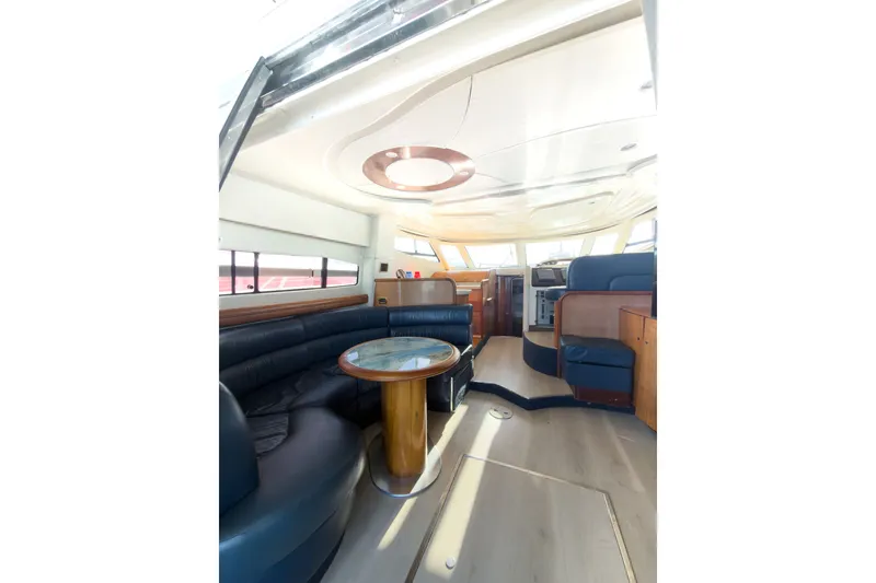 Slide: The Image of Luxurious interior of 2002 Cranchi Atlantique 50 yacht with elegant seating and modern design. - 12