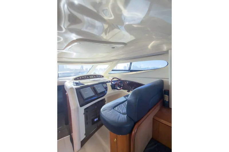 Slide: The Image of Interior of 2002 Cranchi Atlantique 50 yacht with modern helm and seating. - 13