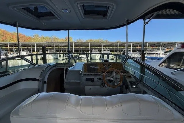 Slide: The Image of 2006 Formula 40 Performance Cruiser cockpit with white seating and marina view. - 15