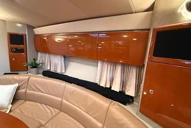 Slide: The Image of Luxurious interior of a 2006 Formula 40 Performance Cruiser with leather seating and wooden cabinetry. - 41