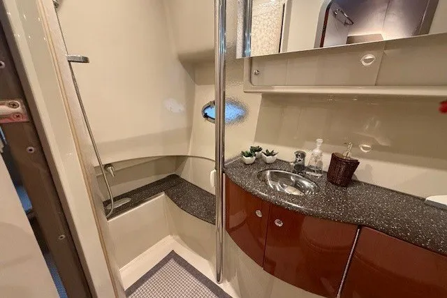 Slide: The Image of 2006 Formula 40 Performance Cruiser bathroom with modern sink, shower, and storage. - 29