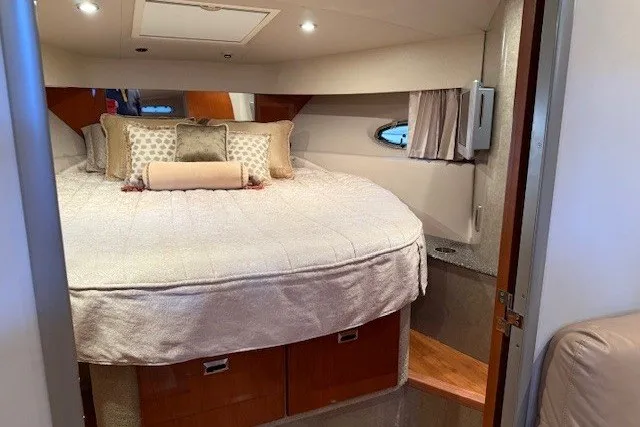 Slide: The Image of Luxurious cabin interior of a 2006 Formula 40 Performance Cruiser with cozy bedding and ambient lighting. - 34