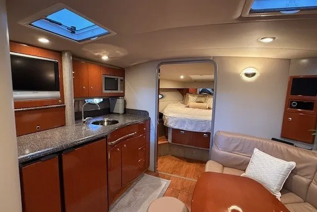Slide: The Image of Interior of a 2006 Formula 40 Performance Cruiser with modern amenities and cozy seating. - 42