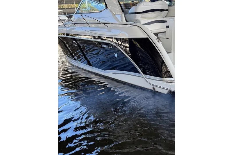 Slide: The Image of 2006 Formula 40 Performance Cruiser docked on calm water. - 4