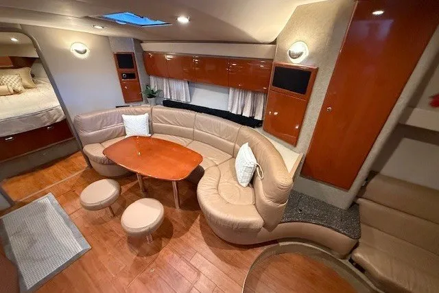Slide: The Image of Luxurious interior of a 2006 Formula 40 Performance Cruiser with elegant seating and wood finishes. - 32