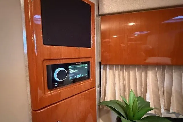 Slide: The Image of Interior of 2006 Formula 40 Performance Cruiser with wood paneling and audio system. - 38