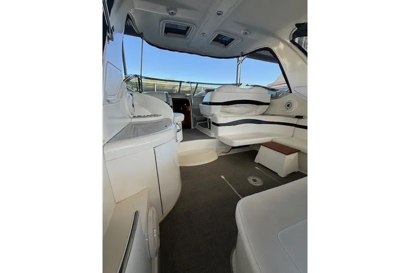 Slide: The Image of Interior of a 2006 Formula 40 Performance Cruiser with white seating and modern design. - 10