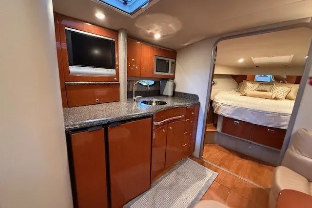 Slide: The Image of Interior of 2006 Formula 40 Performance Cruiser with kitchen and cozy bedroom. - 33