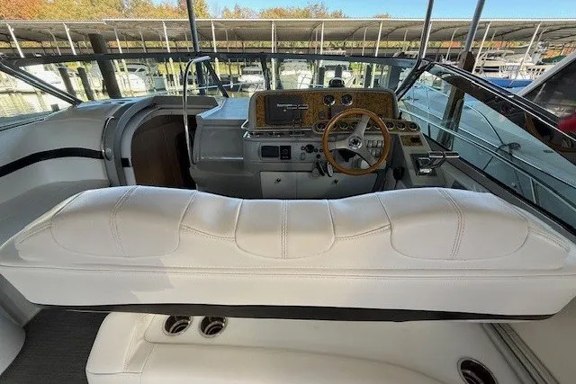 Slide: The Image of 2006 Formula 40 Performance Cruiser cockpit with white seating and wooden steering wheel. - 13