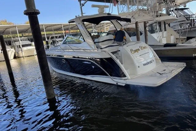 The Image of 2006 Formula 40 Performance Cruiser docked at marina, sleek design, luxury boating experience. - 1