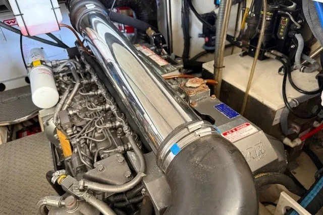 Slide: The Image of Engine compartment of a 2006 Formula 40 Performance Cruiser, showcasing detailed mechanical components. - 25