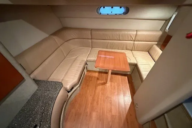 Slide: The Image of Interior of 2006 Formula 40 Performance Cruiser with leather seating and wooden table. - 27