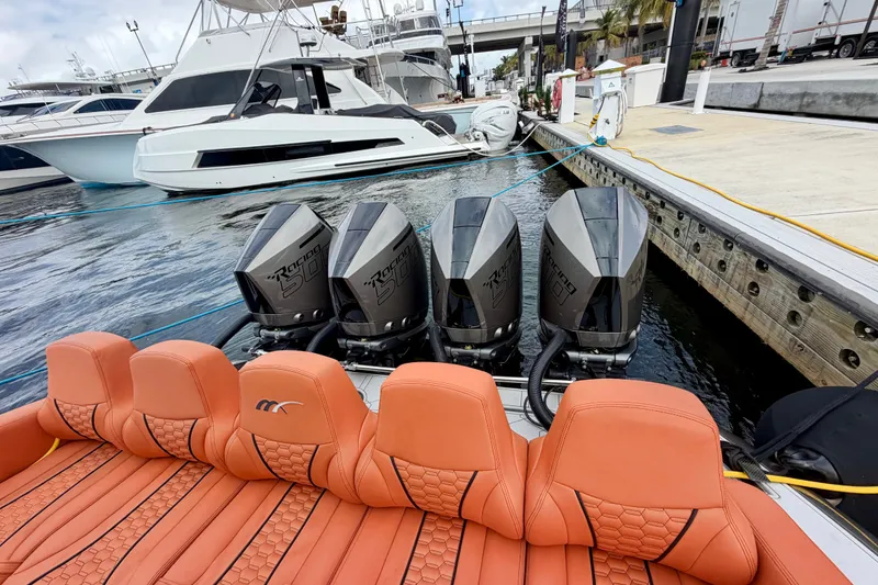 Slide: The Image of Luxury Midnight Express 43 Solstice boat with quad engines docked at marina, 2025 model. - 6