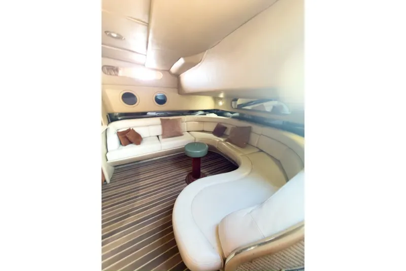 Slide: The Image of Luxurious interior of 1997 Sea Ray 500 Sundancer yacht with plush seating and elegant design. - 14
