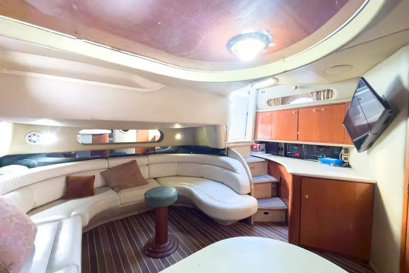 Slide: The Image of Luxurious interior of a 1997 Sea Ray 500 Sundancer yacht with plush seating and modern amenities. - 13