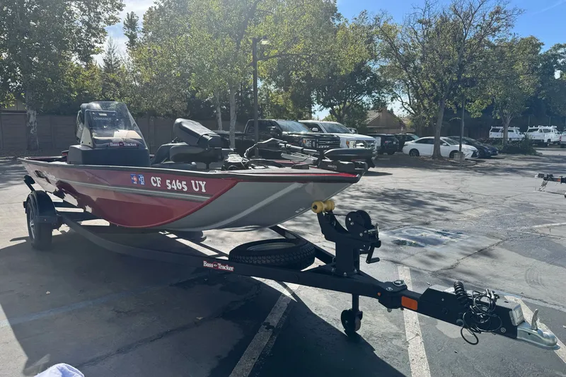 The Image of 2025 Tracker Bass Tracker Classic XL boat on trailer in parking lot. - 0