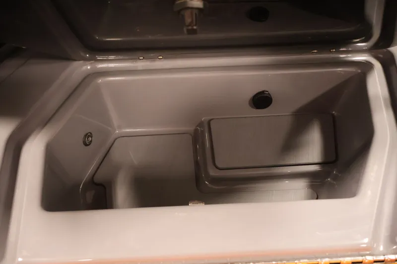 Slide: The Image of Interior compartment of 2025 Axis T250 boat, featuring a sleek, gray finish. - 28