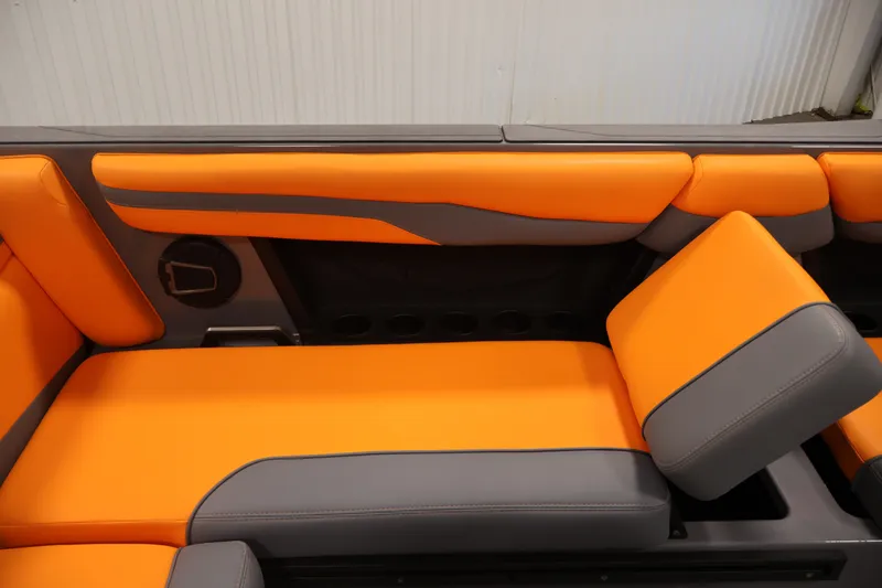 Slide: The Image of 2025 Axis T250 boat interior with vibrant orange and gray seating design. - 33