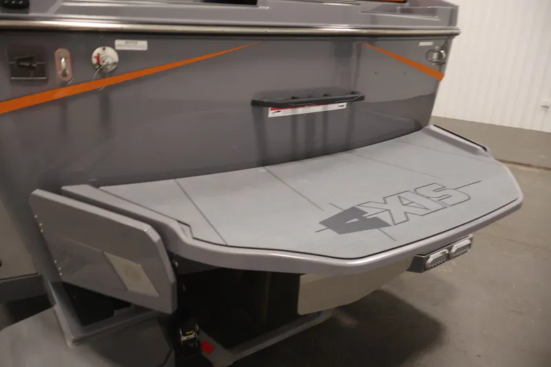 Slide: The Image of 2025 Axis T250 boat rear platform with logo, featuring sleek gray design and orange accents. - 49