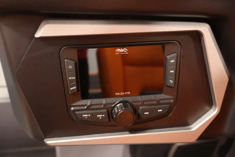 Slide: The Image of 2025 Axis T250 audio control panel with buttons and display screen. - 21