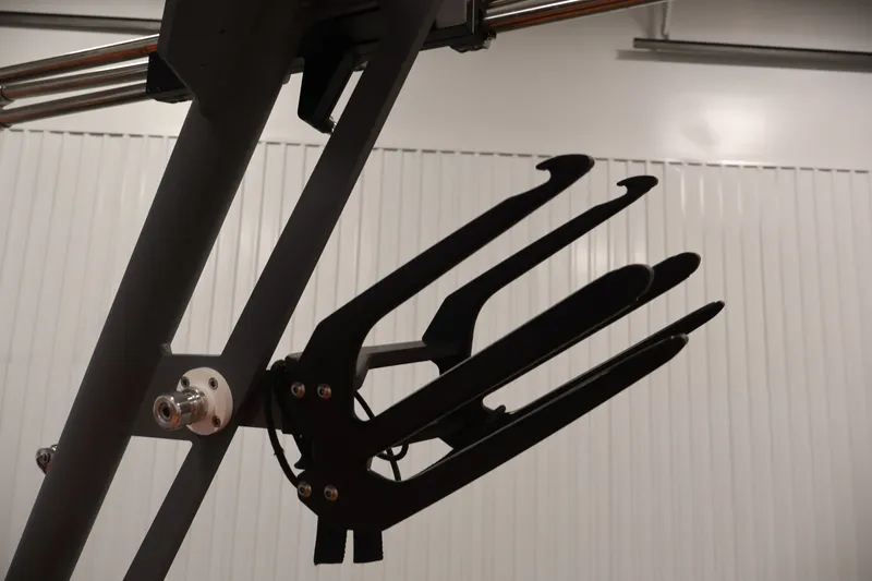 Slide: The Image of Axis T250 2025 boat accessory, featuring a sleek black metal rack against a white background. - 46