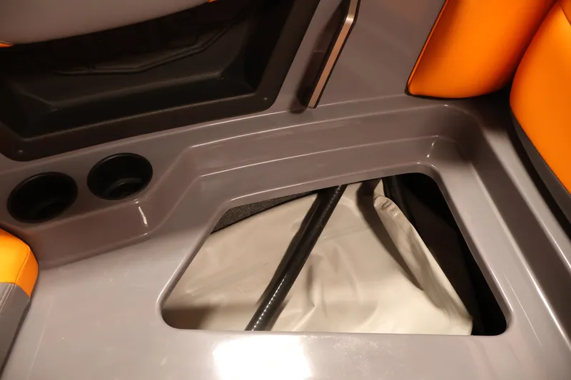 Slide: The Image of 2025 Axis T250 boat interior with storage compartment and cup holders. - 14