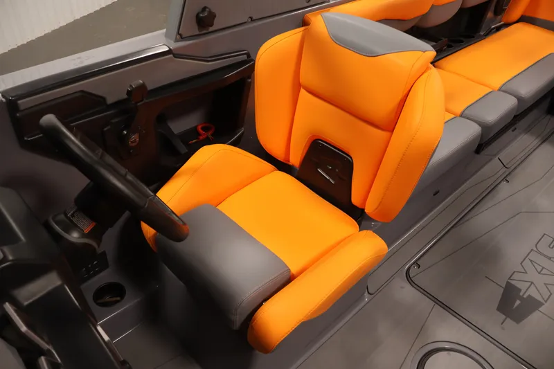 Slide: The Image of Interior of 2025 Axis T250 boat with vibrant orange and gray seating. - 25