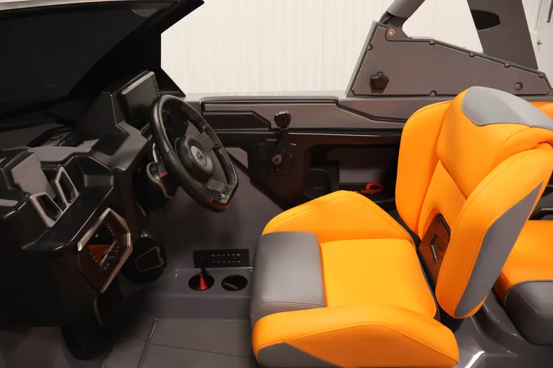 Slide: The Image of Interior of 2025 Axis T250 with vibrant orange and gray seating. - 17