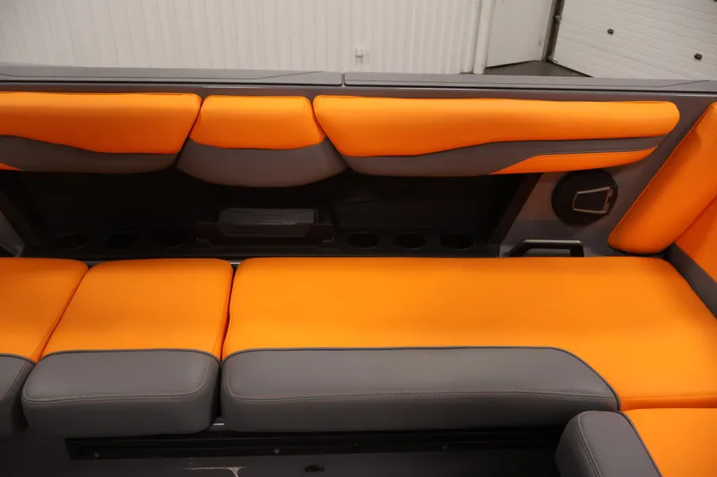 Slide: The Image of 2025 Axis T250 boat interior with vibrant orange and gray seating. - 36
