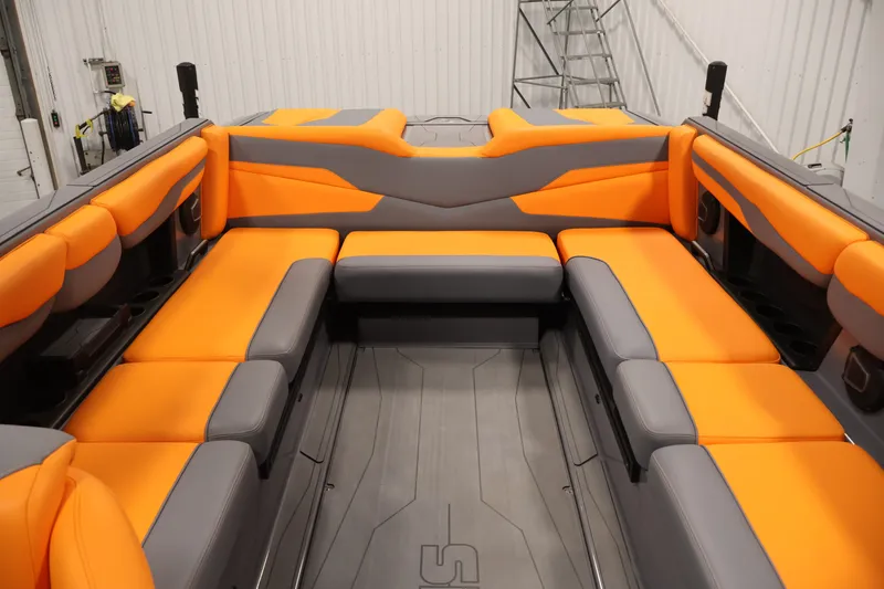Slide: The Image of Luxurious interior of 2025 Axis T250 boat with orange and gray seating. - 30