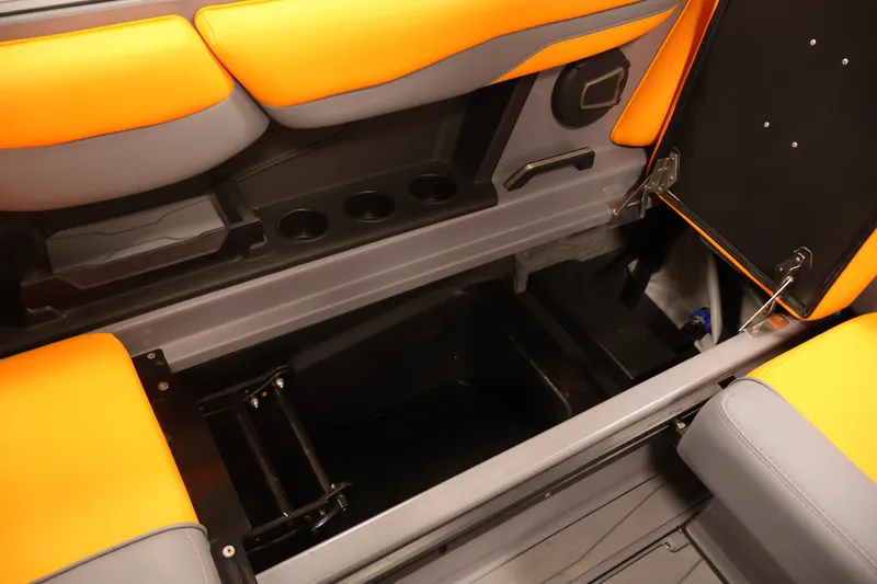 Slide: The Image of 2025 Axis T250 boat interior storage compartment with orange and gray seating. - 38