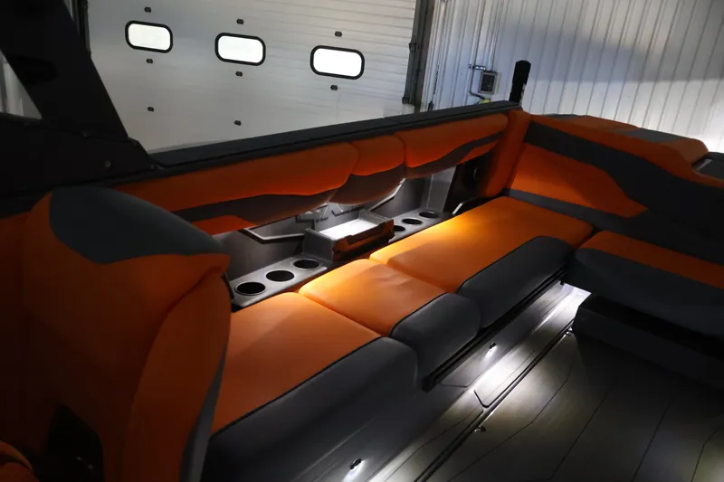 Slide: The Image of Luxurious interior of 2025 Axis T250 boat with orange and gray seating. - 65