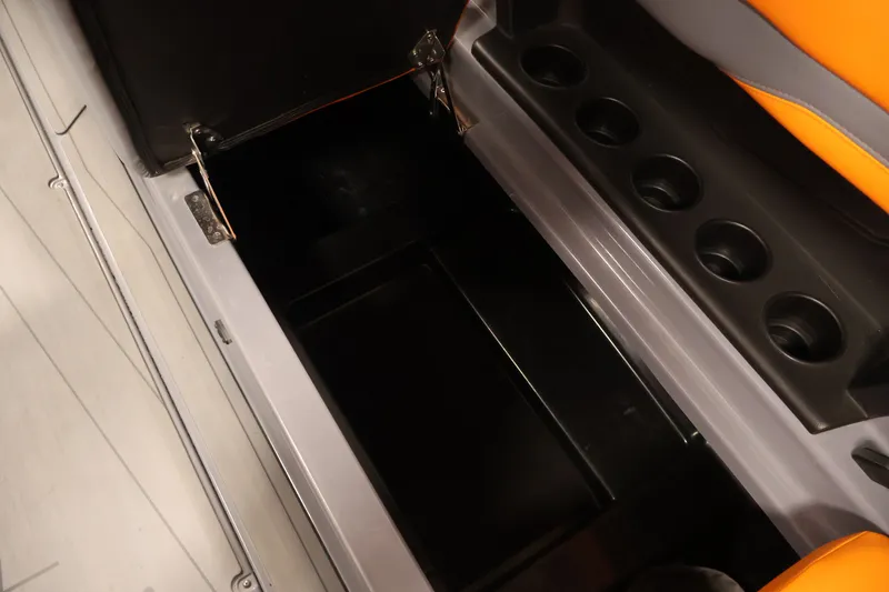 Slide: The Image of Open storage compartment in 2025 Axis T250 boat with cup holders. - 31