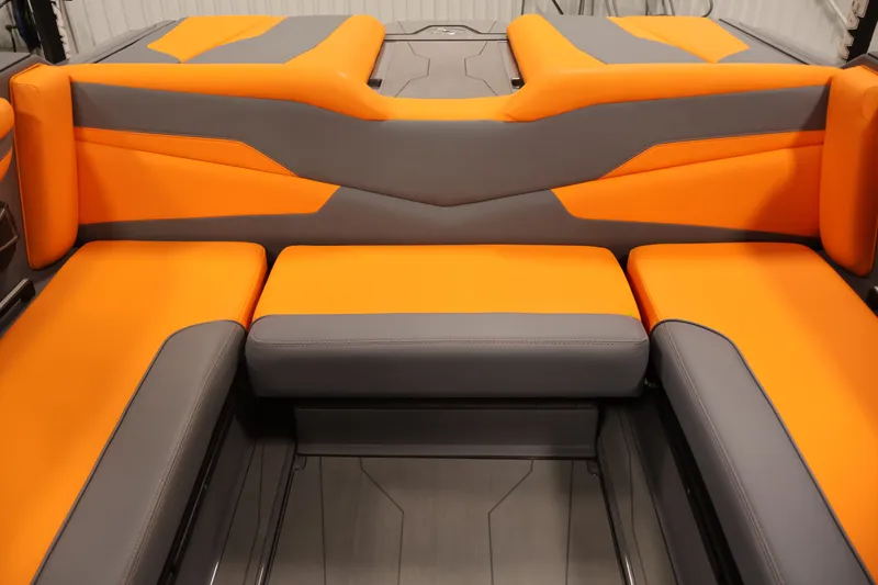 Slide: The Image of 2025 Axis T250 boat interior with vibrant orange and gray seating. - 39