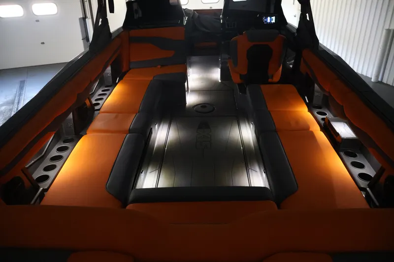 Slide: The Image of Luxurious interior of 2025 Axis T250 boat with ambient lighting and orange seating. - 61