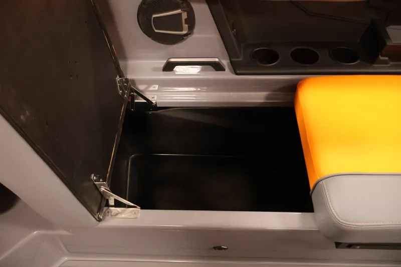 Slide: The Image of Open storage compartment in 2025 Axis T250 boat with yellow seat cushion. - 35