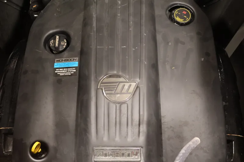 Slide: The Image of Engine cover of 2025 Axis T250 with Monsoon branding and ISO certification label. - 43