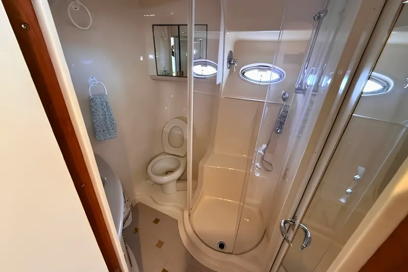 Slide: The Image of Bathroom interior of 2000 Sea Ray 560 Sedan Bridge yacht with shower and toilet. - 19