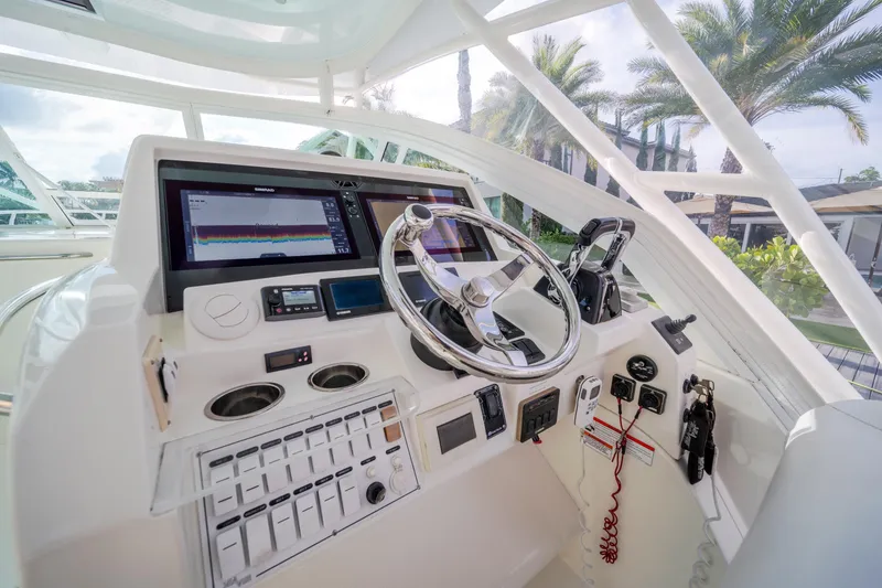 Slide: The Image of Helm of 2011 SeaVee 430 Sport Express with modern navigation equipment and steering wheel. - 20