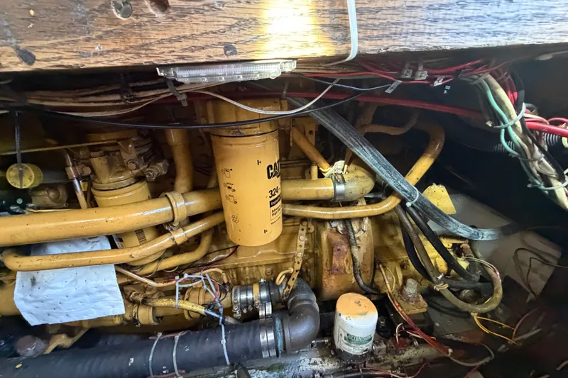 Slide: The Image of Engine compartment of a 1971 Bertram 35 Sport Fisherman with visible wiring and components. - 44