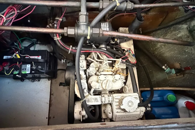 Slide: The Image of Engine compartment of a 1971 Bertram 35 Sport Fisherman boat, featuring wiring and components. - 38