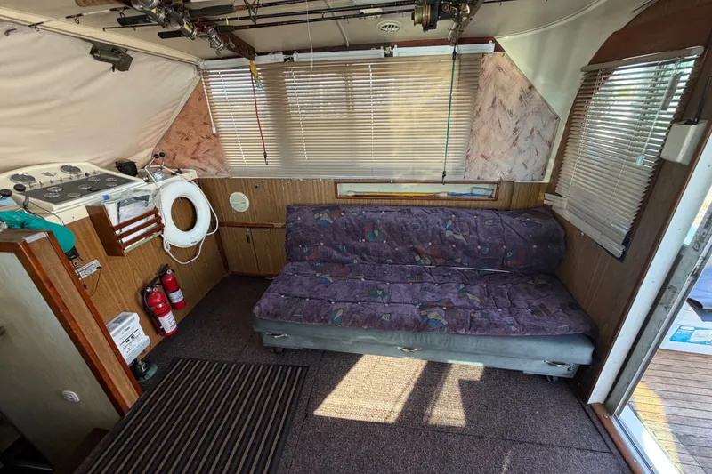 Slide: The Image of Interior of a 1971 Bertram 35 Sport Fisherman with sofa, blinds, and safety equipment. - 19