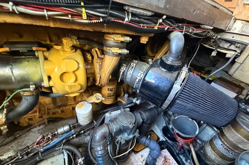 Slide: The Image of Engine compartment of a 1971 Bertram 35 Sport Fisherman boat, showcasing mechanical components. - 42
